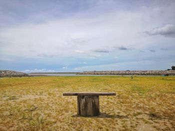 The bench was lonely on the beach.