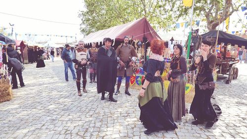 Group of people in market stall