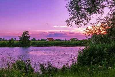 Scenic view of lake against sky during sunset