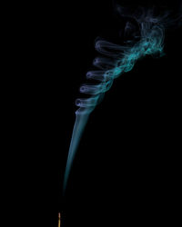 Close-up of smoke against black background