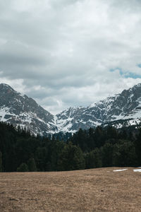 Scenic view of snowcapped mountains against sky