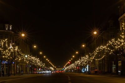 Illuminated street lights at night