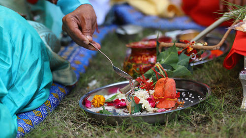 Midsection of man preparing food