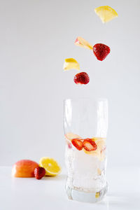 Close-up of fruits against white background