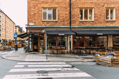 Sidewalk cafe by building in city