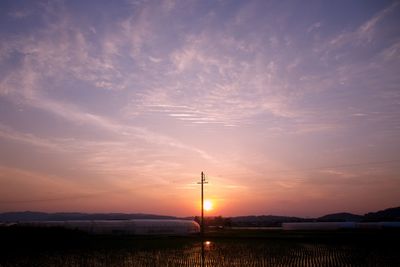 Scenic view of silhouette land against sky during sunset