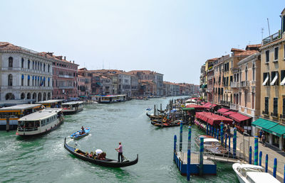 Gondoliers sail into the grand canal in venice