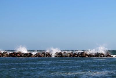 Scenic view of sea against clear sky