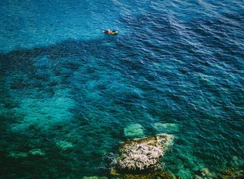 High angle view of people on sea