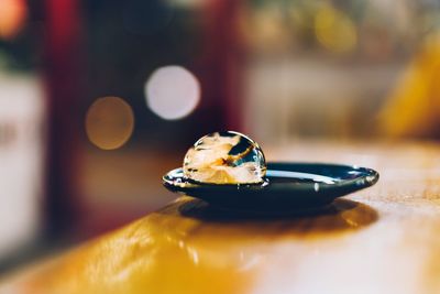 Close-up of ladybug on table