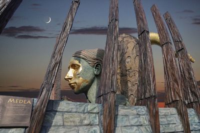 Low angle view of statue against sky