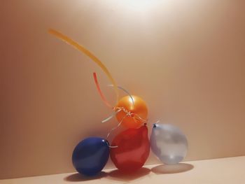 Close-up of candles on table against white background