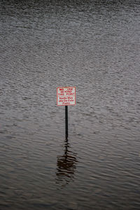 Information sign by water