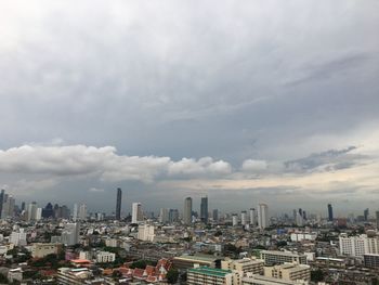 Aerial view of modern buildings in city against sky