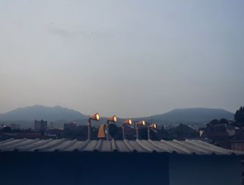 Buildings in city against sky