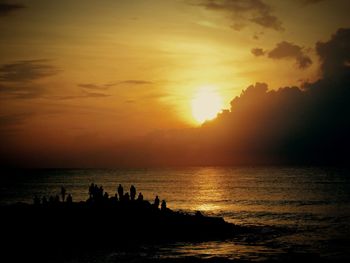 Scenic view of sea at sunset