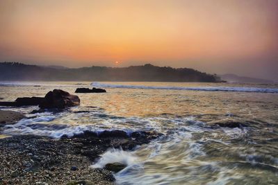 Scenic view of sea against sky during sunset