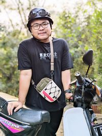 Portrait of young man riding motorcycle