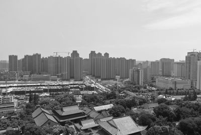 High angle view of buildings against clear sky