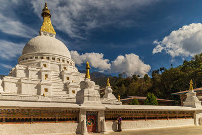 View of temple building against cloudy sky