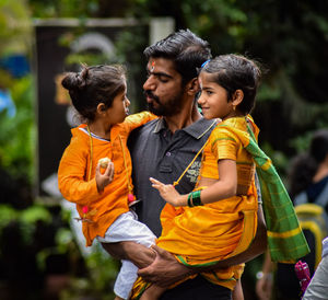 Full length of father and daughter outdoors
