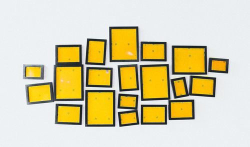 Close-up of yellow over white background