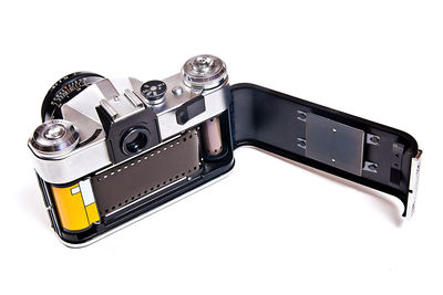 Close-up of camera over white background
