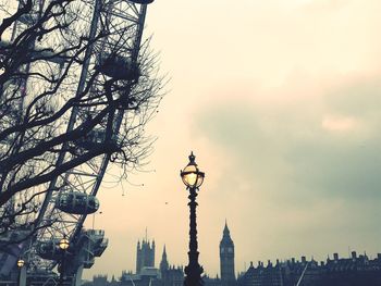 Low angle view of silhouette statue against sky