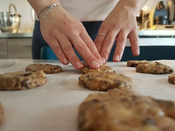 Cookies,midsection of woman preparing food on table