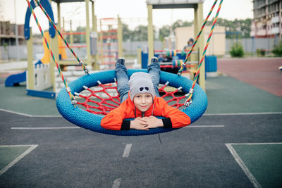 Portrait of boy playing in playground