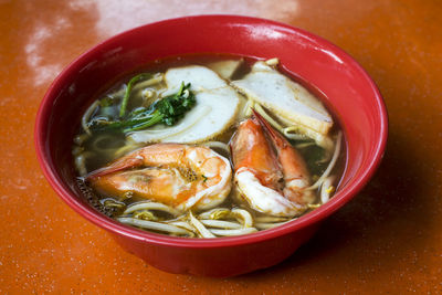 High angle view of prawn noodles soup served on table