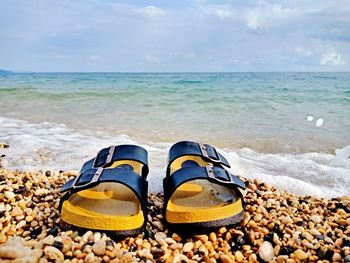 High angle view of shoes on beach