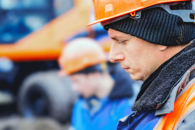 Rear view of man working at construction site