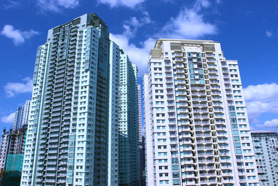 Low angle view of building against cloudy sky