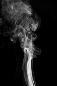 Close-up of smoke against black background