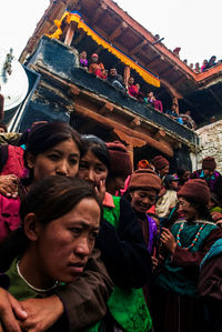 People in temple against sky