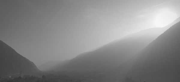 Scenic view of mountains against cloudy sky