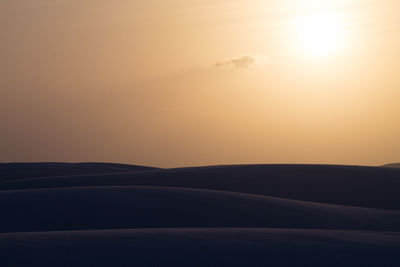 Scenic view of landscape against sky during sunset