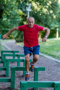 Full length of man exercising in park