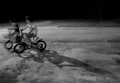 Man riding bicycle on street