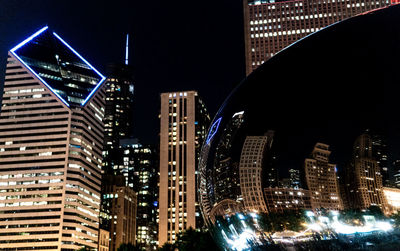 Illuminated buildings in city at night