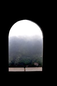 Landscape seen through arch window