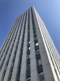 Low angle view of modern buildings against clear blue sky