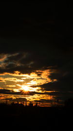 Scenic view of dramatic sky during sunset