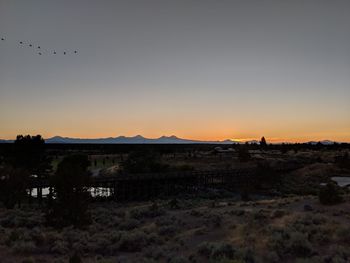 Scenic view of sunset over mountain against sky