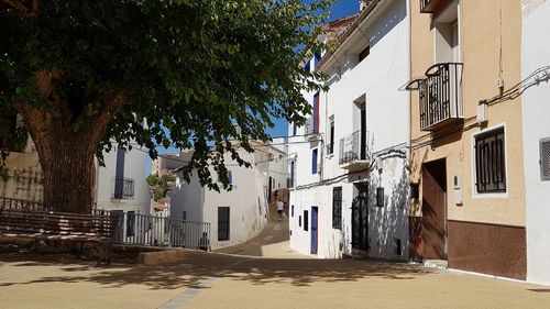 Street amidst buildings against sky