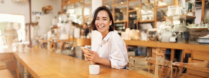 Portrait of young businesswoman working in office