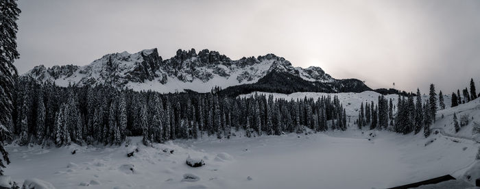 Scenic view of snow covered mountains against sky