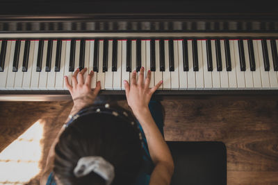 High angle view of girl playing pain