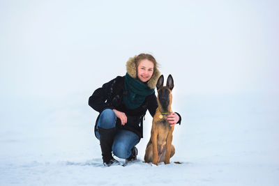 Full length of a dog on snow